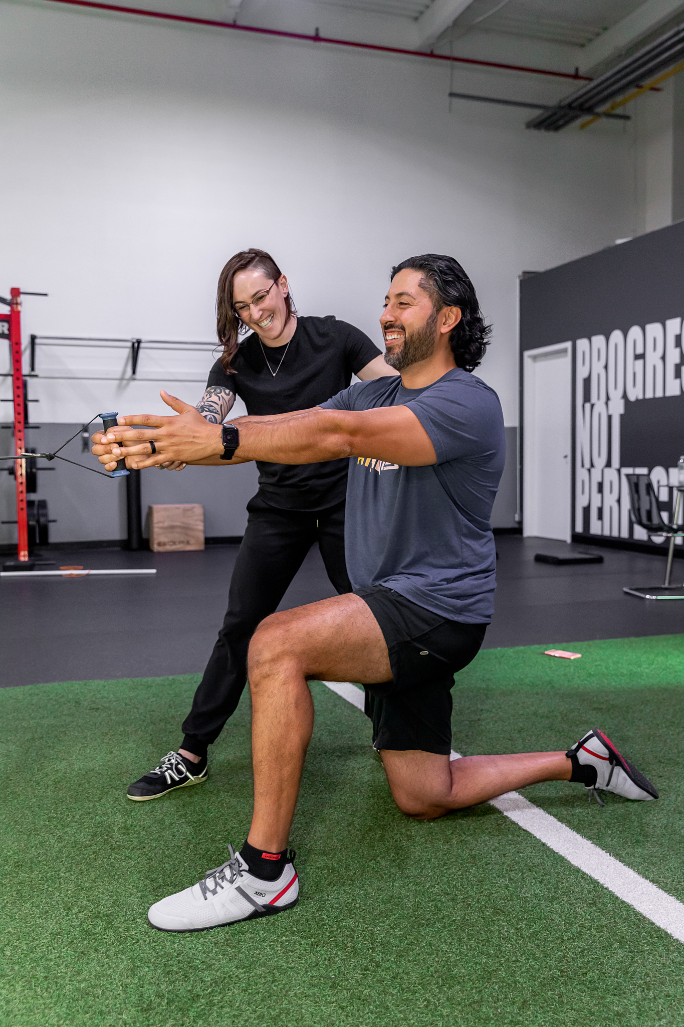 Dr. Alison doing active rehab with a patient