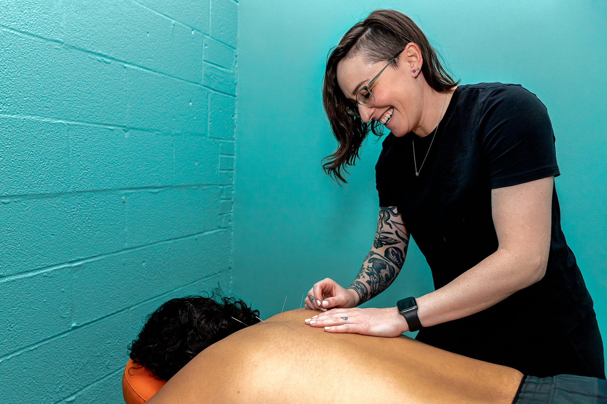 Dr. Alison doing acupuncture